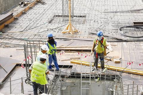 Workers preparing slab reinforcement