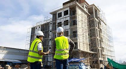 Engineers in high-vis vests at building site